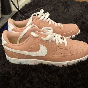 These are Pink and white customized Nike women’s shoes, size 10.